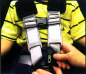 Growing Out of the Child Seat: Child Safety Lawyer Todd Tracy teaching how to use a seat belt for a child