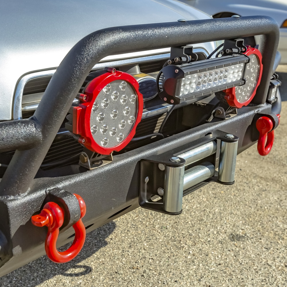 Large Bumper Guard: Grille guard with spotlights and round tow hook