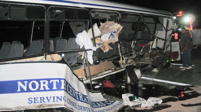 NTSB Finds Joint Failures In Champion Bus Crash. Photo shows side of Champion Bus where 3 female softball players suffered deadly ejection out of bus.