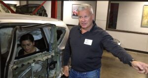 Car Accident Lawyer Todd Tracy Demonstrating Injuiries Caused by T Bone Car Accident