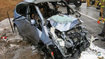 John Eagle Collision Center Accused of Gluing on Honda Fit Roof Causing Driver to Burn in Car Accident