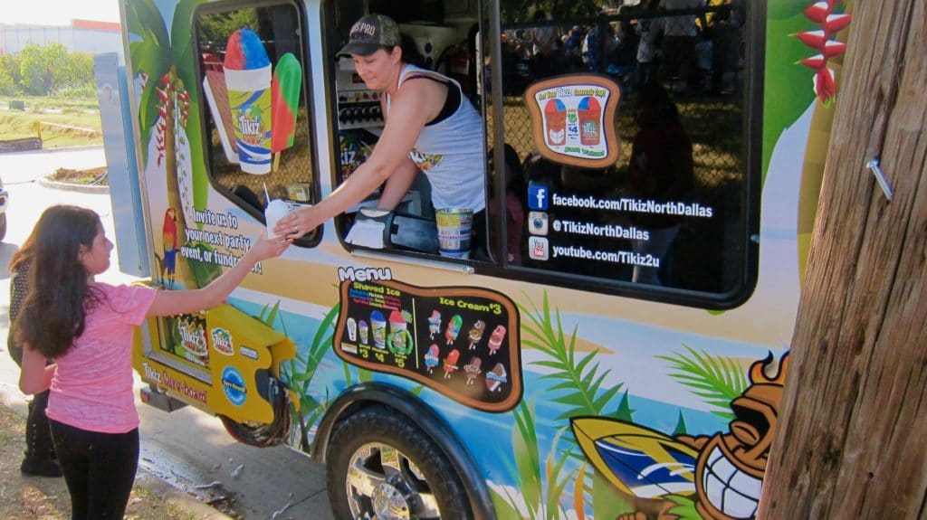 Food Truck Dispenses Shaved Ice Treats Donated by Vehicle Safety Lawyer Todd Tracy for Medano Elementary School Carnival in Dallas